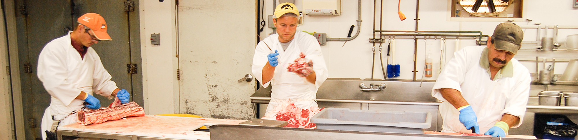 butchering meat for a producer